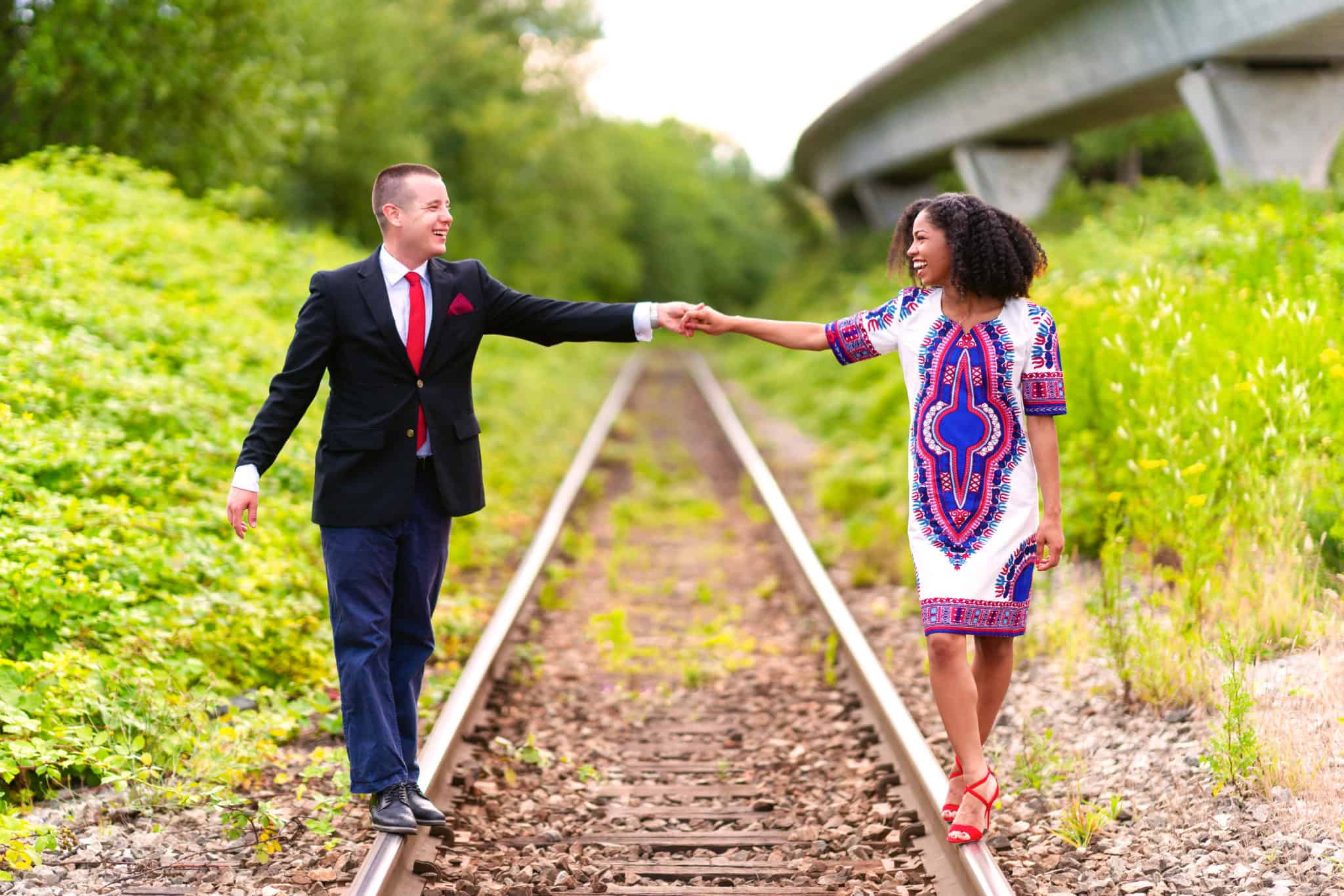 Engagement Photo on Train Tracks | African print dress | Natural Hair