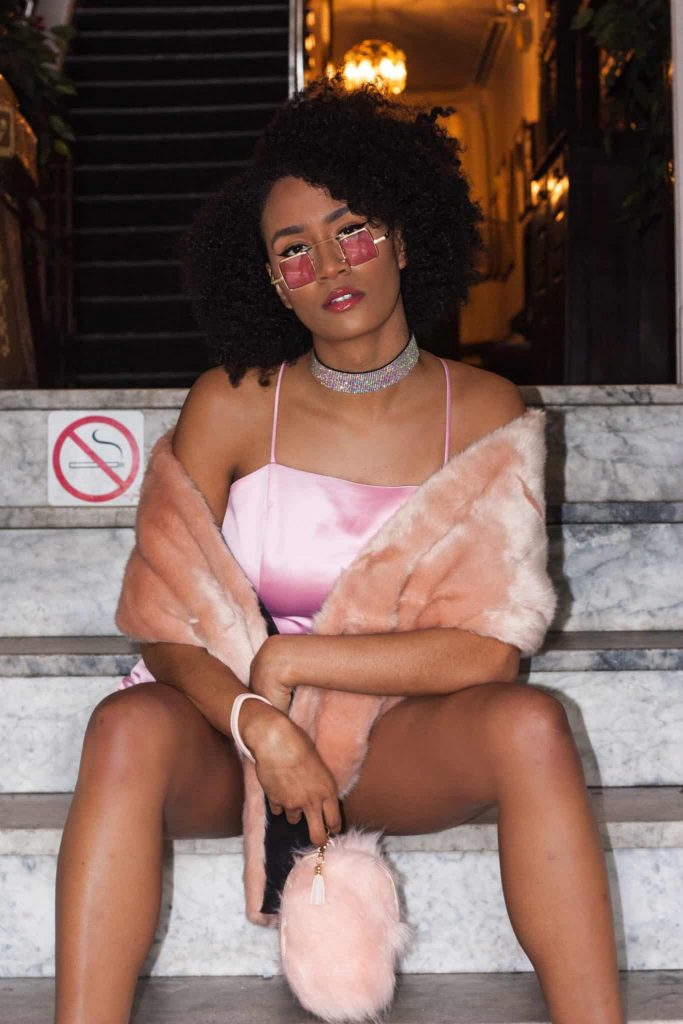 Glamorous Date Night Outfit | black woman with Sparkly choker and Faux Fur Shawl , Pink glasses