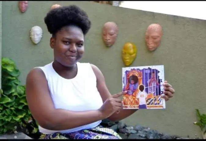 Saccheen Laing holding her book: Thrones not Cells