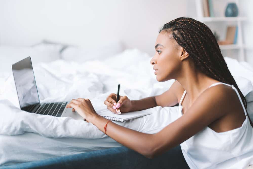Black Girl Looking at Laptop | What Blogging Platform to choose | Website Builder, Wix, Squarespace, or Wordpress