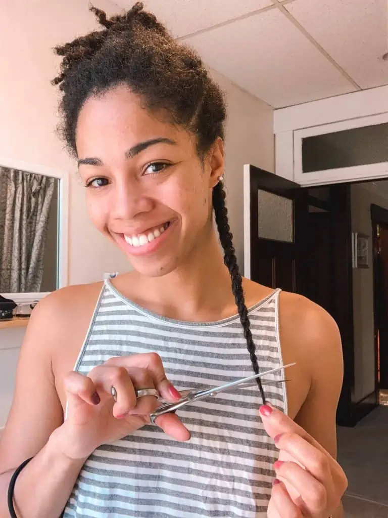 Black Natural Hair Blogger Showing how to trim hair in twists