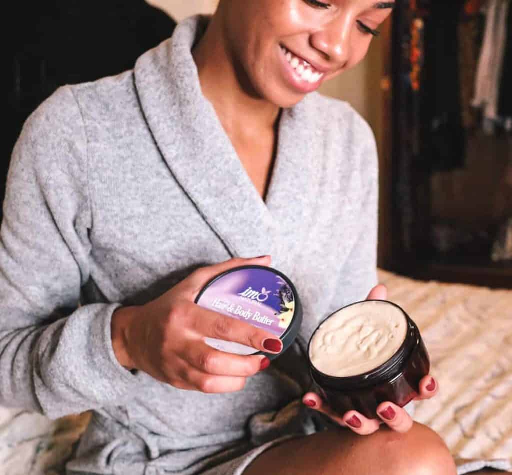 Black Canadian Blogger opening jar of IMONatural Hair & Body Butter in Lavender