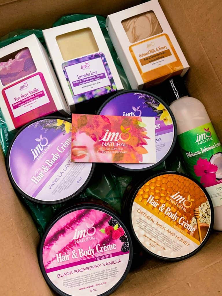 Package of handmade artisan soaps, body and hair butters and creams, and a leave in conditioner from Black-Owned ImoNatural