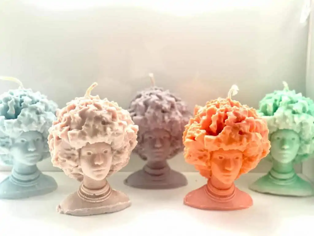 Black Owned Candles in the shape of a woman with Afro by O'Chan Made
