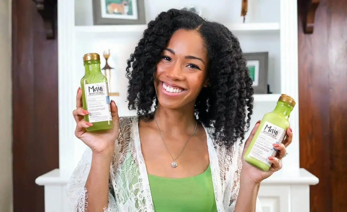 Black Natural Hair Blogger with Twist out holding Maui Hair Products | Flaxseed shampoo and conditioner